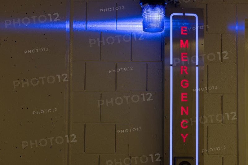Illuminated Emergency Sign in Parking Garage