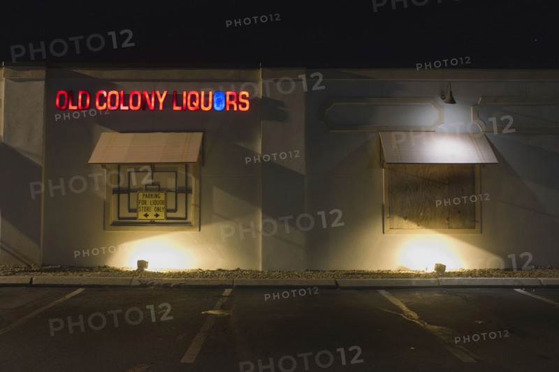 Liquor Store Parking Lot and Building Exterior at Night