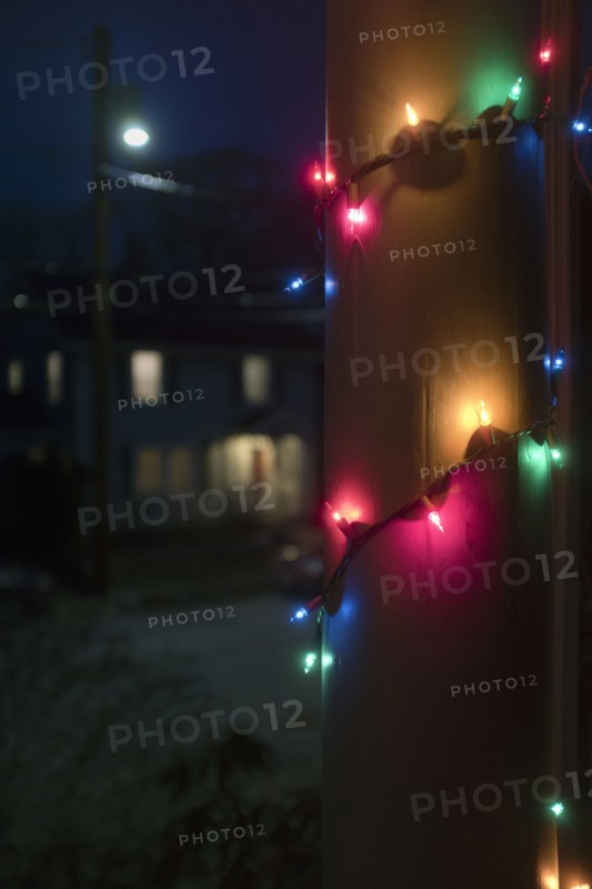 Christmas Lights wrapped around Porch Column at Night