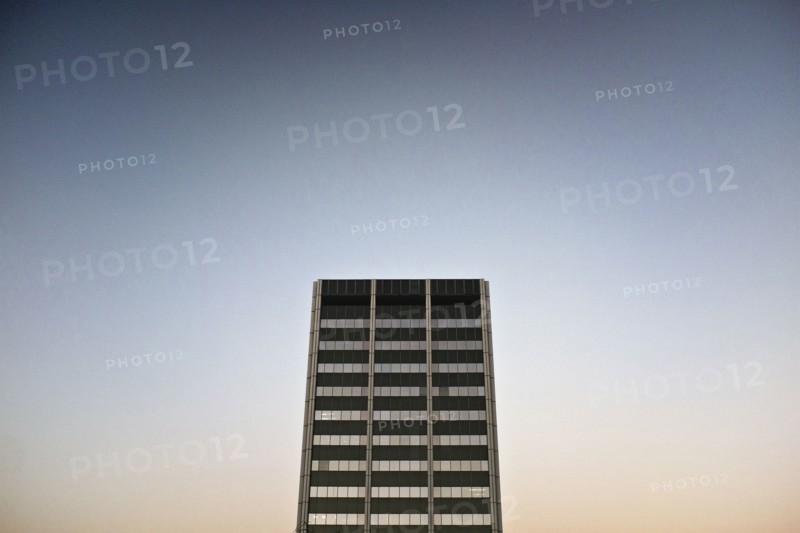 Modern Office Building Exterior against Sky at Dusk