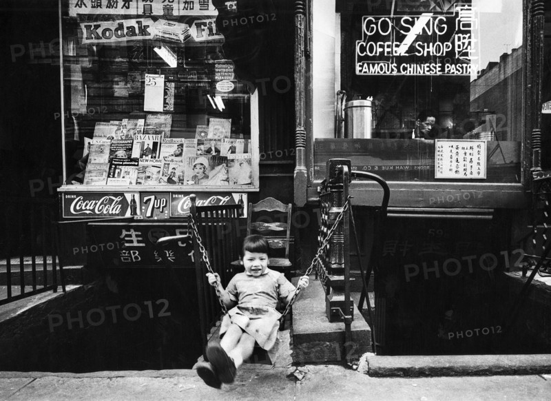 Young Girl Swinging in front of Go Sing Coffee Shop