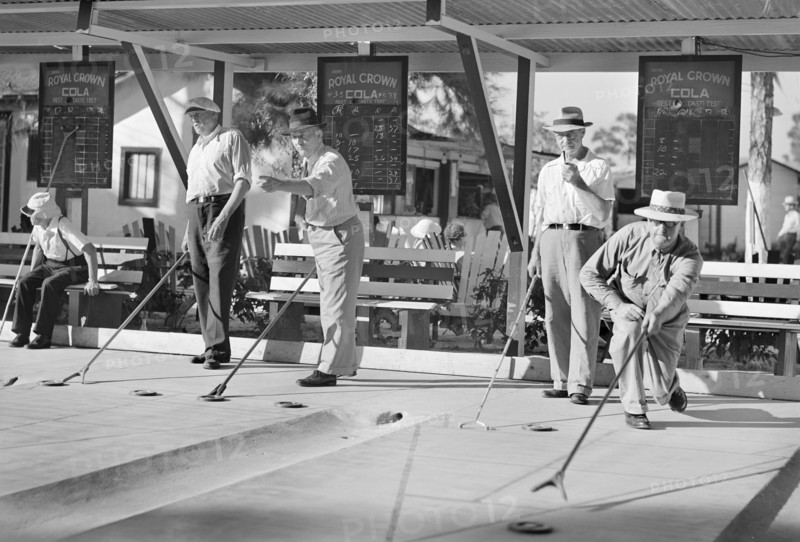 Group of Men Playing Shuffleboard