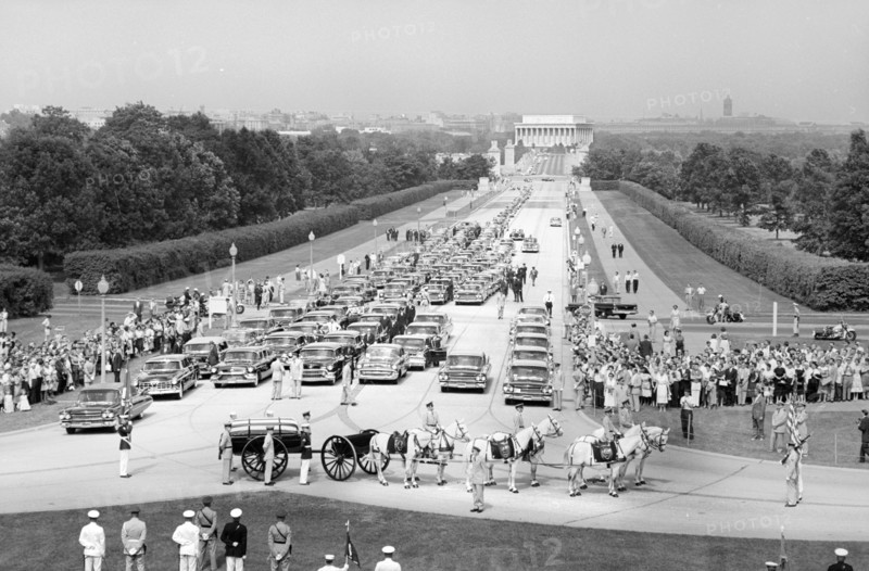 Funeral Procession and Flag-draped casket of U.S. Secretary of State John Foster Dulles on horse-drawn caisson at entrance to Arlington National Cemetery