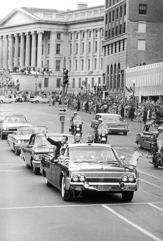 Astronaut Gordon Cooper in a car with U.S. Vice President Lyndon Baines Johnson during parade