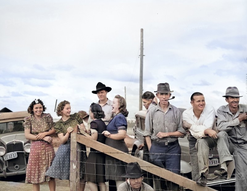 Group of people watching a Sunday afternoon baseball game