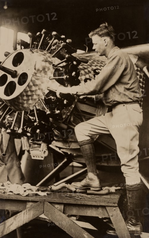 Charles Lindbergh working on engine of his airplane Spirit of St. Louis