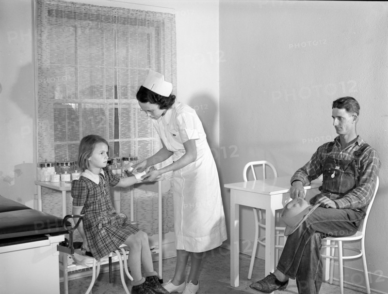 Patient receiving medical aid in health clinic