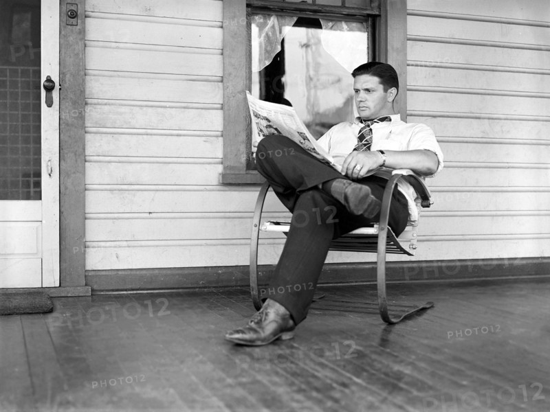 Clifford Shorts reading evening paper