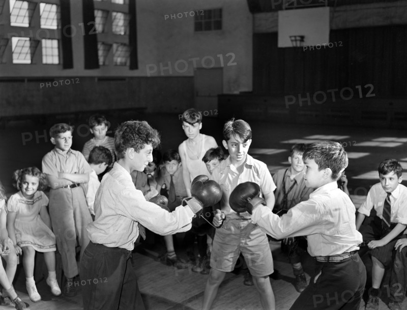 Boys Boxing match in gymnasium of community center