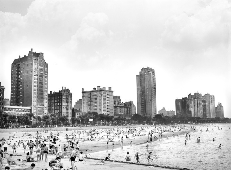 Beach scene along Lake Michigan with cityscape in background