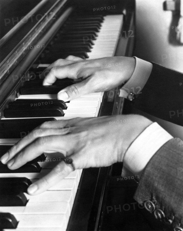 Hands playing Piano