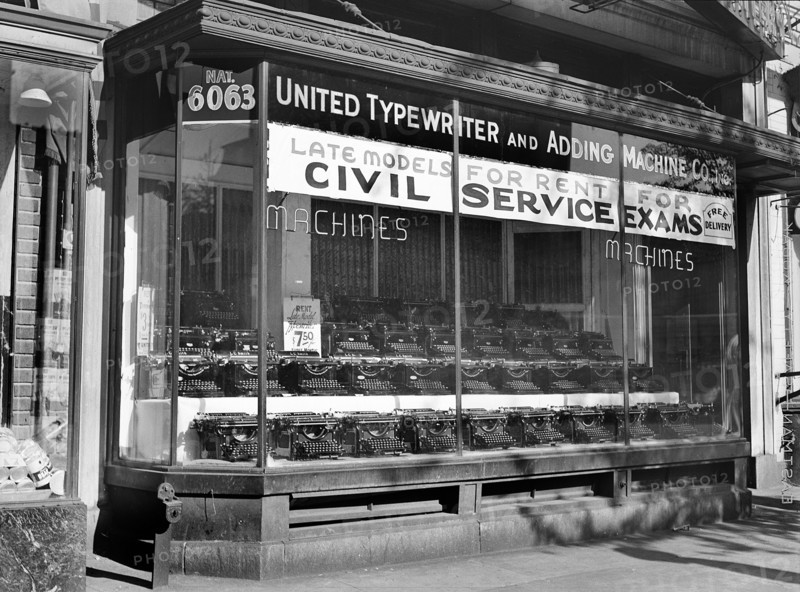 Rows of typewriters on display in store window