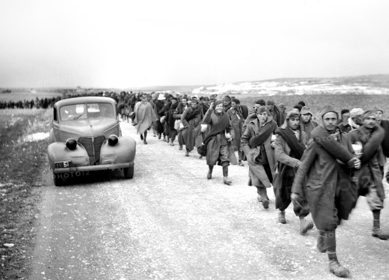 Italian prisoners of war walking along road after detraining at Wadi al-Sarar Railway Station