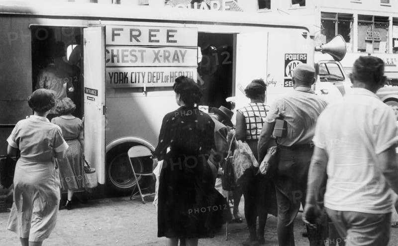 Group of men and women in line to enter free chest x-ray van operated by the New York City Department of Health