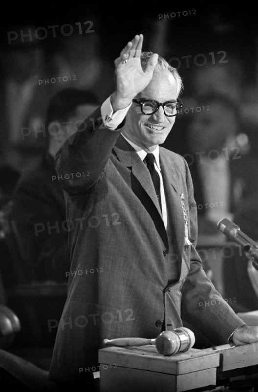 U.S. Senator Barry Goldwater waving from rostrum during Republican National Convention