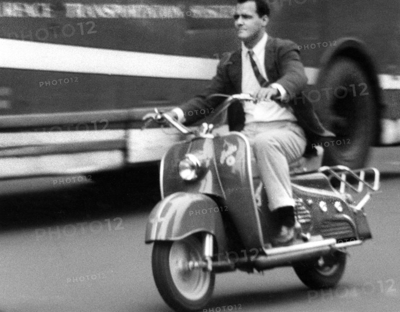 Man riding motorized scooter
