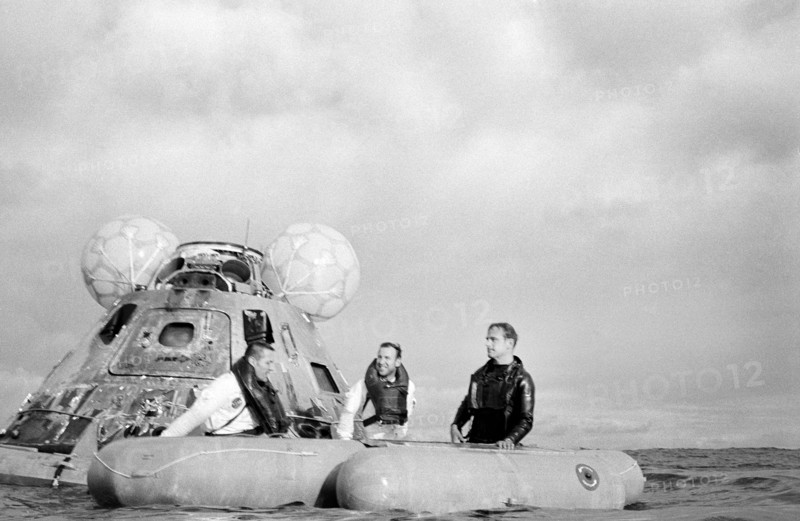 American Astronauts James A. Lovell Jr. (center)