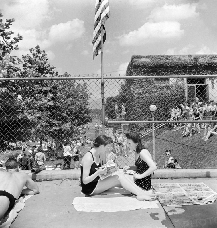 Two young women relaxing by community pool, Washington, D.C., USA, Marjory Collins, U.S. Office of War Information, July 1942