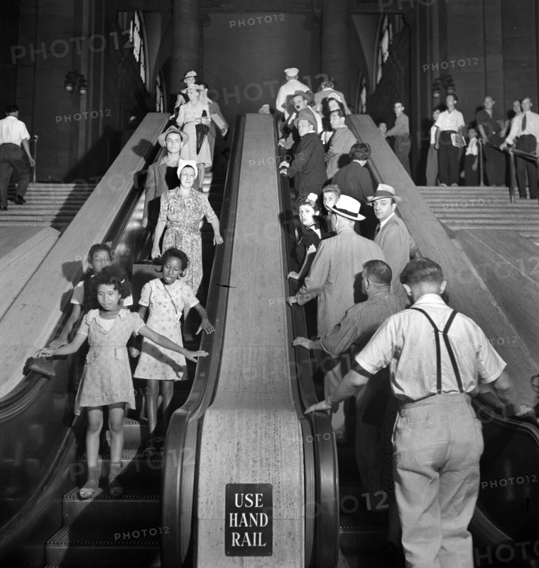 Group of people on escalators, Pennsylvania Station, New York City, New York, USA, Marjory Collins, U.S. Office of War Information, August 1942