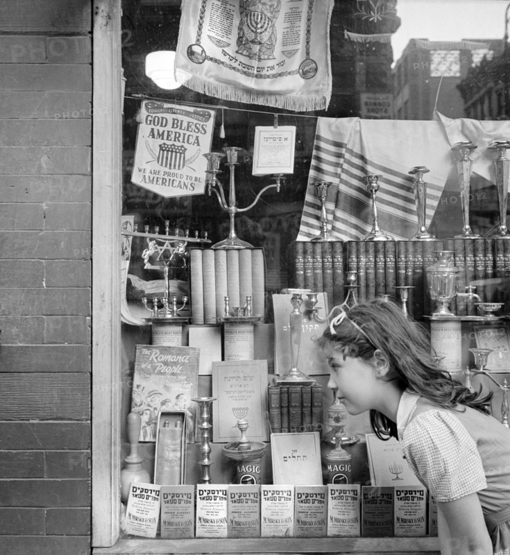 Young girl looking in window of Jewish shop, Broome Street, New York City, New York, USA, Marjory Collins, U.S. Office of War Information,