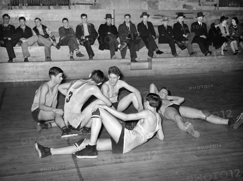 High School basketball players resting between periods, Eufaula, Oklahoma, USA, Russell Lee, U.S. Farm Security Administration, February 1940