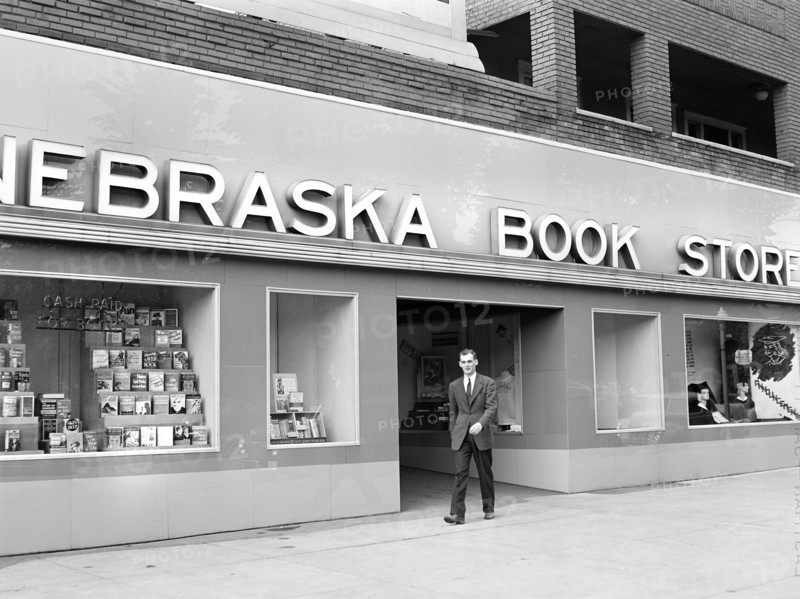 John Cockle walking out of campus bookstore, University of Nebraska, Lincoln, Nebraska, USA, John Vachon, U.S. Office of War Information, May 1942