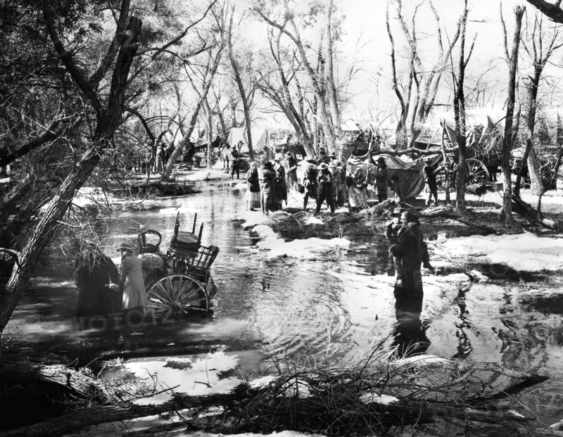 Brigham Young and group of Mormons encamped at Sugar Creek while heading west, on-set of the film, "Brigham Young", 20th Century-Fox, 1940