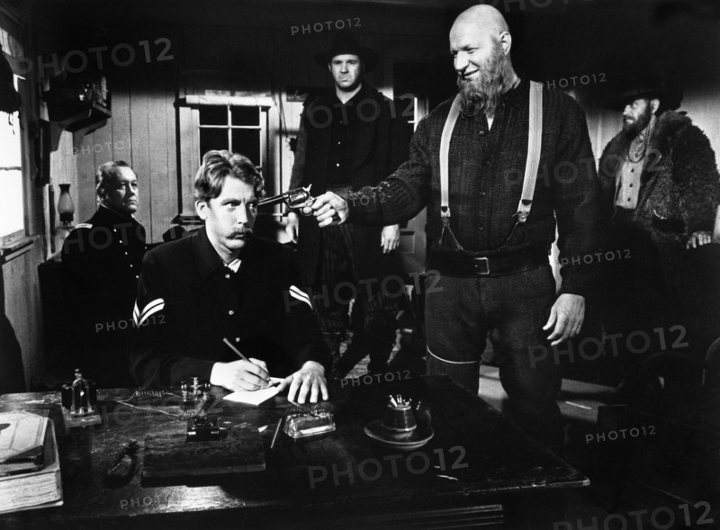 Robert Tessier (with gun), on-set of the film, "Breakheart Pass", United Artists, 1976