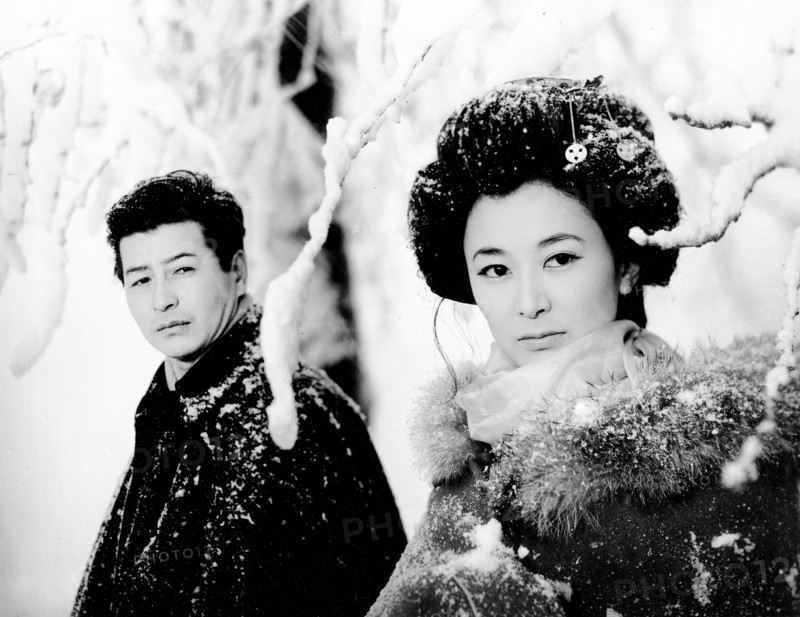 Keiko Kishi, Ryo Ikebe, on-set of the Japanese film, "Yukiguni", English title: "Snow Country", Toho Company, 1957