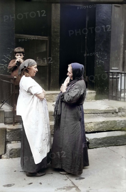 Two Syrian women talking in front of residential building, New York City, New York, USA, Bain News Service, 1916