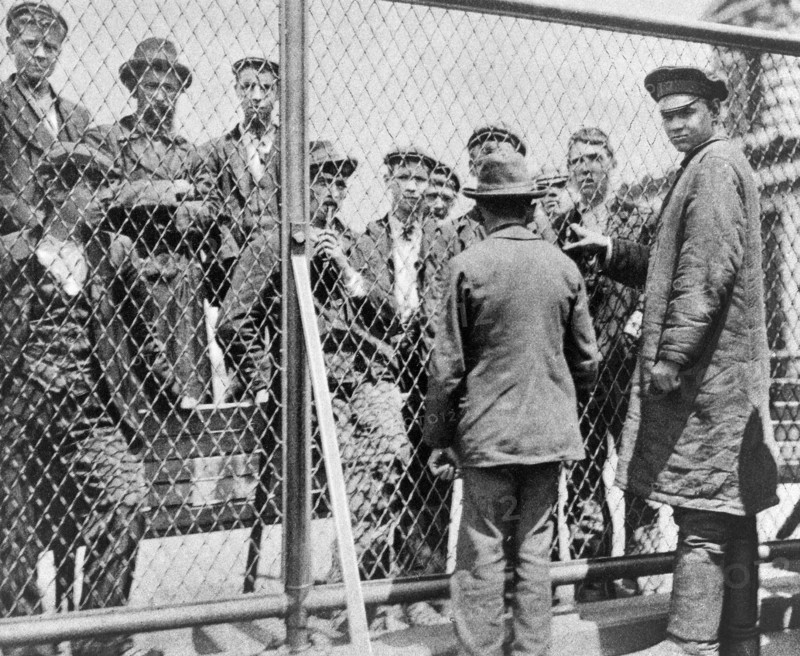 Immigrants scheduled for deportation being held in detention pen on roof of main building, Ellis Island, New York City, New York, USA, Matine Company, 1902