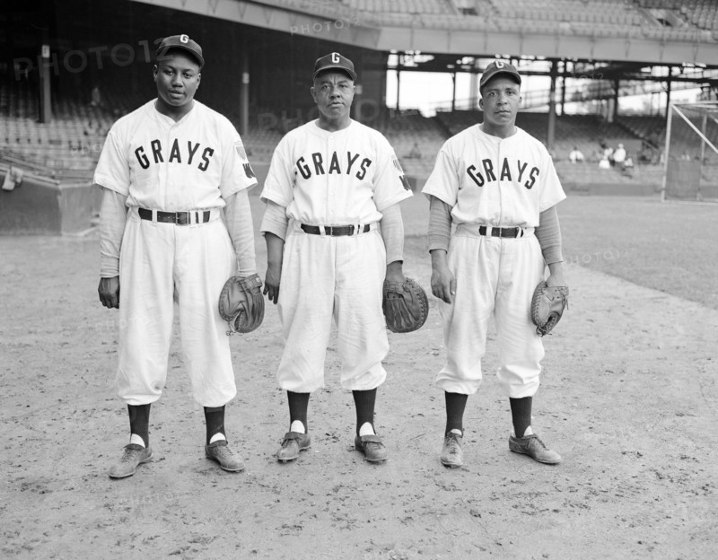 Washington Homestead Grays baseball players, Josh Gibson, Ted "Double Duty" Radcliffe, and Euthumn "Eudie" Napier, standing on the field at Griffith Stadium, Washington, D.C., USA, Robert H. McNeill, Robert H. McNeill Family Collection, 1947