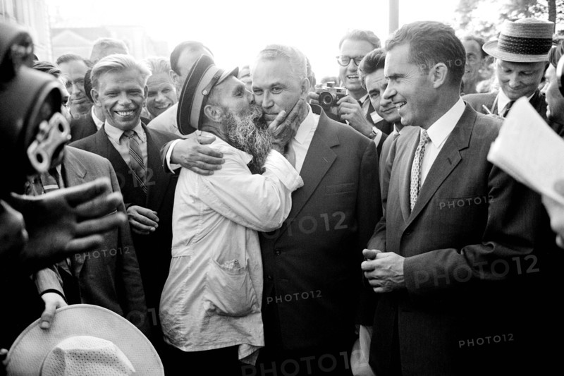 U.S. Vice President Richard Nixon watching as man kisses Soviet politician Frol Kozlov during Nixon's visit to the Soviet Union, Thomas J. O'Halloran, U.S. News & World Report Magazine Photograph Collection, July 1959