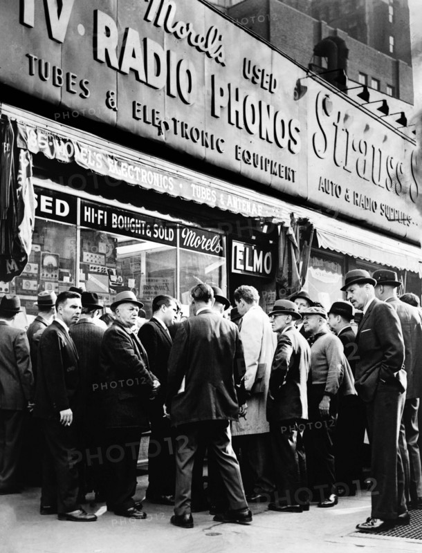 Crowd listening outside radio shop for news on President Kennedy, at Greenwich and Dey Streets, New York City, New York, USA, O. Fernandez, New York World-Telegram and the Sun Newspaper Photograph Collection, November 22, 1963