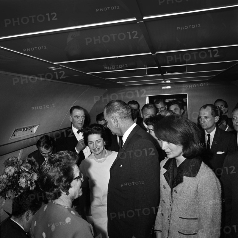 U.S. President Lyndon Johnson and First Lady Claudia "Lady Bird" Johnson with Jacqueline Kennedy after Johnson was sworn in as U.S. President by Judge Sarah Hughes aboard Air Force One after assassination of U.S. President John Kennedy, Jack Valenti, Albert Thomas, Lem Johns, Jack Brooks, Bill Moyers in background, Love Field Airport, Dallas, Texas, USA, Cecil W. Stoughton, November 22, 1963