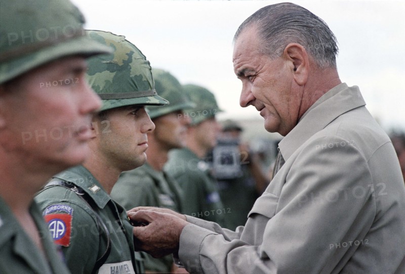 U.S. President Lyndon B. Johnson awarding Distinguished Service Cross to First Lieutenant Marty A. Hammer during visit to Cam Ranh Bay, South Vietnam, Yoichi Okamoto, October 26, 1966