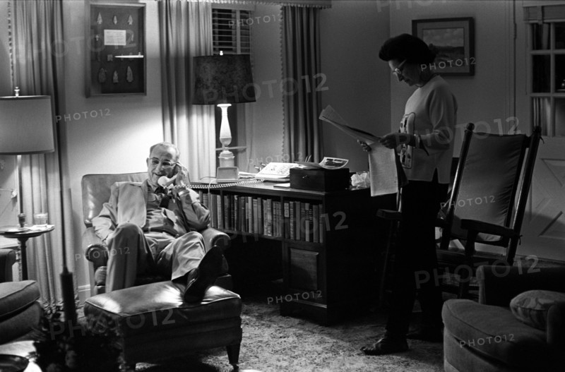 U.S. President Lyndon Johnson talking on telephone, Lady Bird Johnson reading newspaper on Christmas day at LBJ ranch, Stonewall, Texas, USA, Yoichi Okamoto, December 25, 1963
