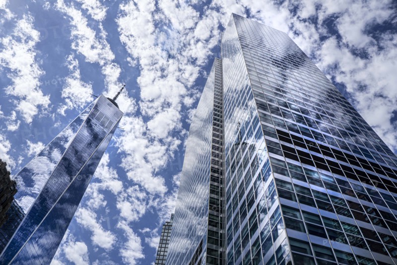 One World Trade Center and 200 West Street, low angle view, building exterior against clouds and blue sky, New York City, New York, USA