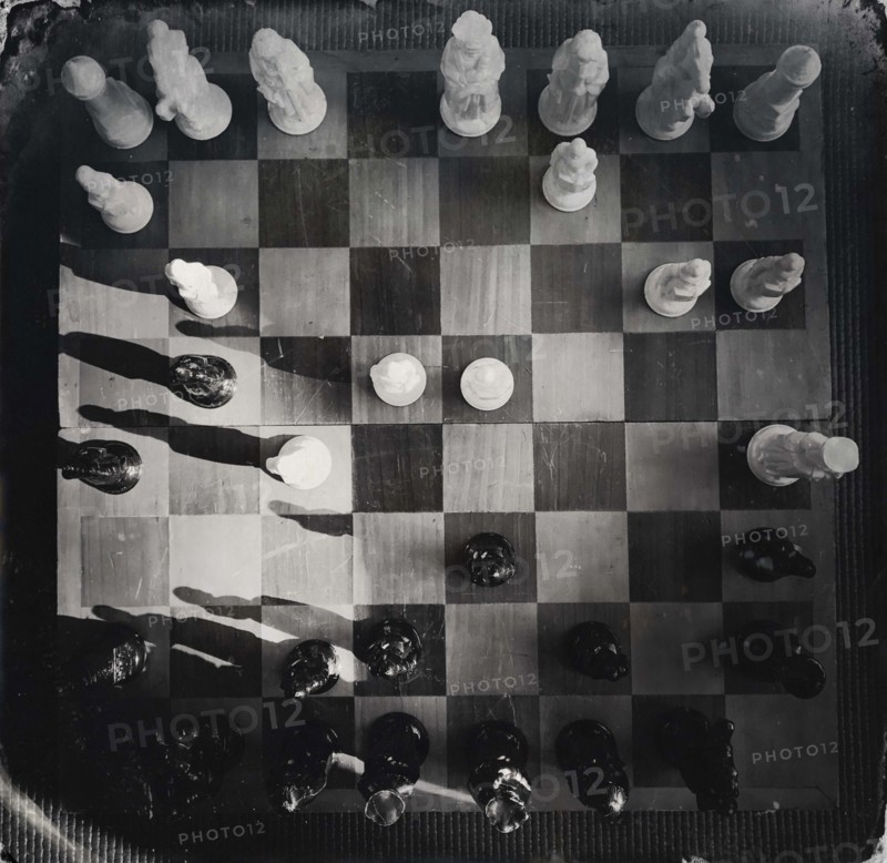 High angle view of chess board and chess pieces