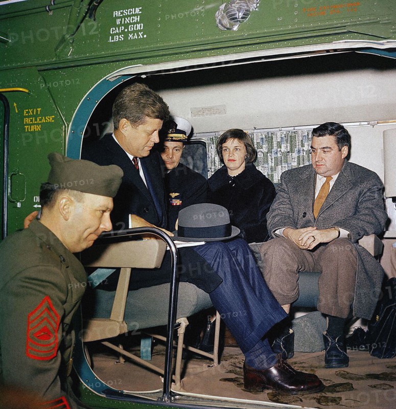 U.S. President John F. Kennedy with Naval Aide to the President Commander Tazewell Shepard, Jr.; Nancy Salinger with husband U.S. Press Secretary Pierre Salinger, wait aboard U.S. Marine Corps helicopter preparing for take off, South Lawn, White House, Washington, D.C., USA, Robert Knudsen, White House Photographs, February 11, 1961