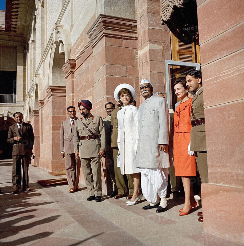 U.S. First Lady Jacqueline Kennedy, President of India Dr. Rajendra Prasad (center) Mrs. Kennedy’s sister, Princess Lee Radziwill of Poland, stand in doorway of Rashtrapati Bhavan, the President’s official residence, New Delhi, India, Cecil Stoughton, White House Photographs, March 12, 1962