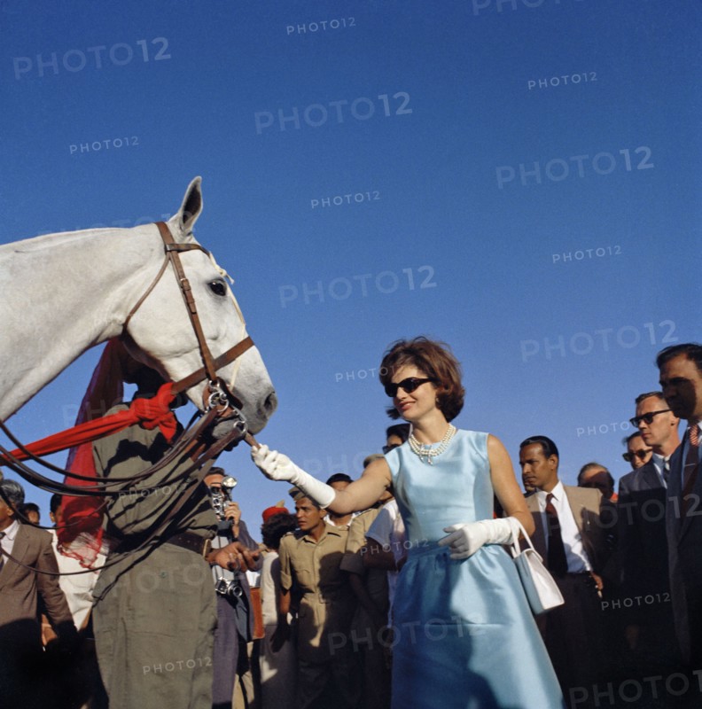 U.S. First Lady Jacqueline Kennedy feeding horse while attending polo match, Jaipur, Rajasthan, India, Cecil Stoughton, White House Photographs, March 19, 1962