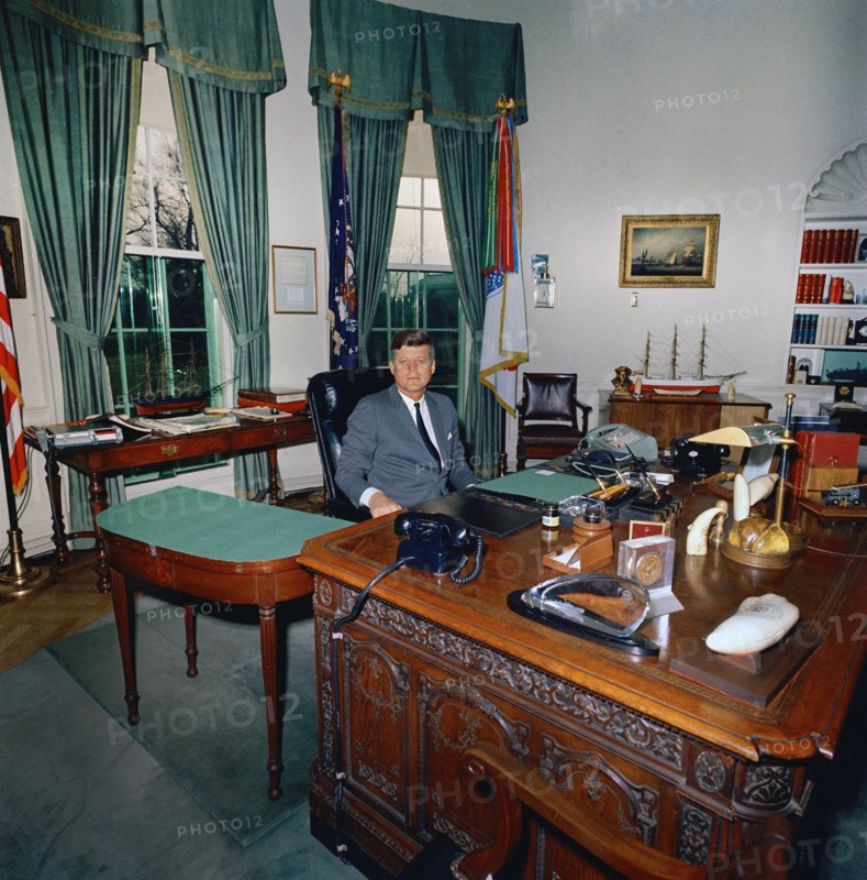 U.S. President John F. Kennedy sitting at his desk (HMS Resolute Desk), Oval Office, White House, Washington, D.C., USA, Cecil Stoughton, White House Photographs, 1962