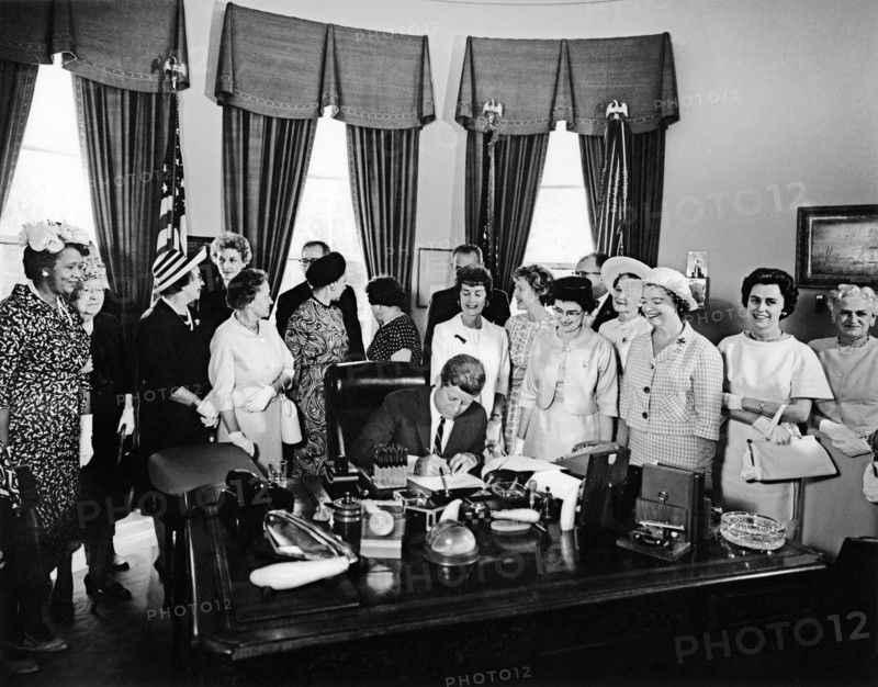 U.S. President John F. Kennedy signing Equal Pay Act, Oval Office, White House, Washington, D.C., USA, Abbie Rowe, White House Photographs, June 10, 1963