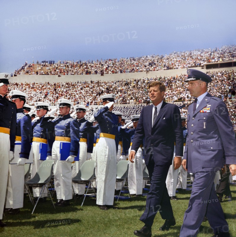 U.S. President John F. Kennedy and Major General Robert H. Warren walking past saluting cadets while attending commencement exercises for the fifth graduating class, Falcon Stadium, U.S. Air Force Academy, Colorado Springs, Colorado, USA, Robert Knudsen, White House Photographs, June 5, 1963