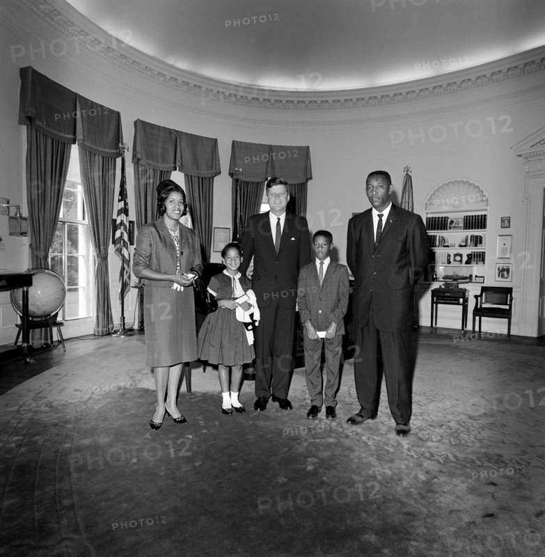 U.S. President John F. Kennedy (center) visiting with Myrlie Evers (far left), widow of civil rights leader, Medgar Evers, her children Reena and Darrell Evers and Charles Evers (far right), brother of Medgar, Oval Office, White House, Washington, D.C., USA, Cecil Stoughton, White House Photographs, June 21, 1963
