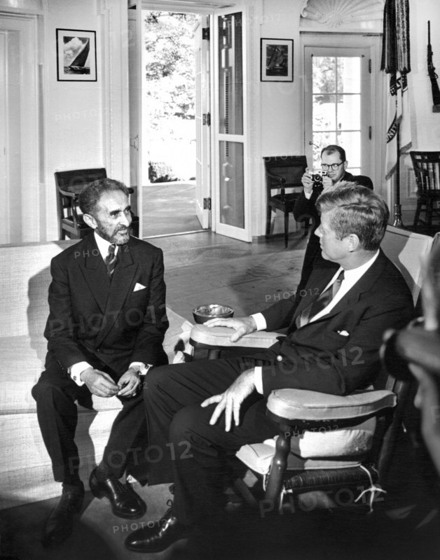 U.S. President John F. Kennedy (in rocking chair) meeting with Emperor of Ethiopia, Haile Selassie I, Oval Office, White House, Washington, D.C., Abbie Rowe, White House Photographs, October 1, 1963