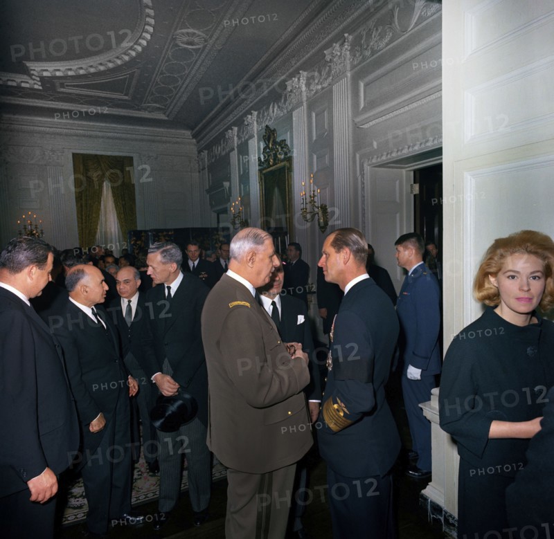 President of France, General Charles de Gaulle, visiting with Prince Philip, Duke of Edinburgh, during a reception at the White House, following the state funeral of U.S. President John F. Kennedy, Washington, D.C., USA, Cecil Stoughton, White House Photographs, November 25, 1963