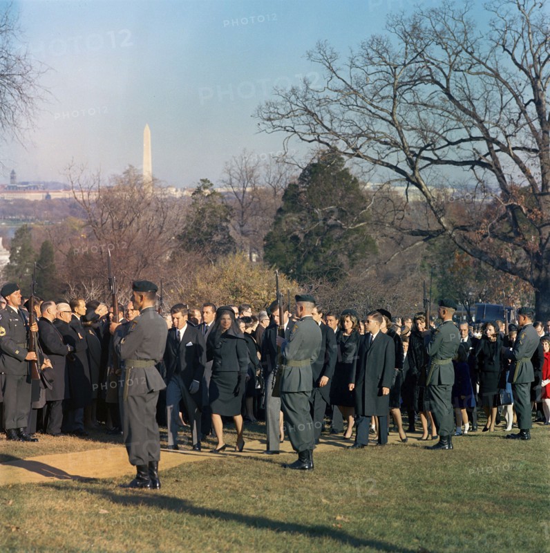 Members of the Kennedy family, led by Jacqueline Kennedy, U.S. Attorney General Robert F. Kennedy and U.S. Senator Edward Kennedy, walk to the gravesite of U.S. President John F. Kennedy upon for graveside services in the state funeral of President Kennedy, Arlington National Cemetery, Arlington, Virginia, USA, Cecil Stoughton, White House Photographs, November 25, 1963