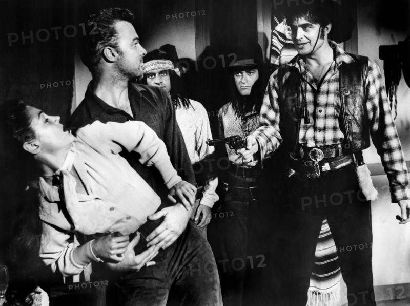 Morgan Jones (left), Joan Taylor (2nd left), Lance Fuller (right), on-set of the western film, "Apapche Woman", American Releasing Corp., 1955